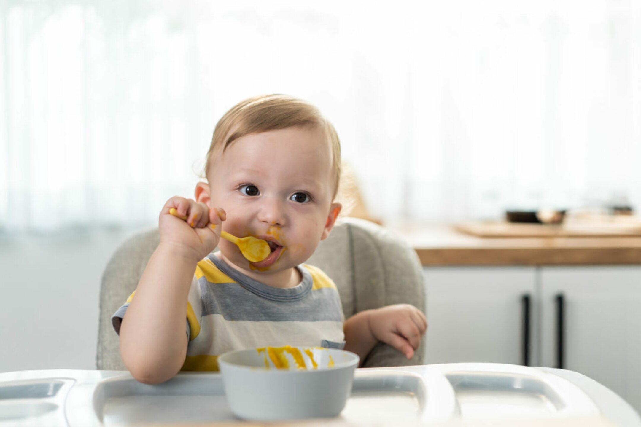 caucasian-young-baby-toddler-eating-healthy-foods-2021-12-09-17-50-25-utc-1-1280x853