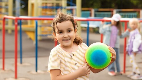 portrait-of-happy-kid-girl-child-in-park-with-colo-2024-03-19-19-15-08-utc (1)