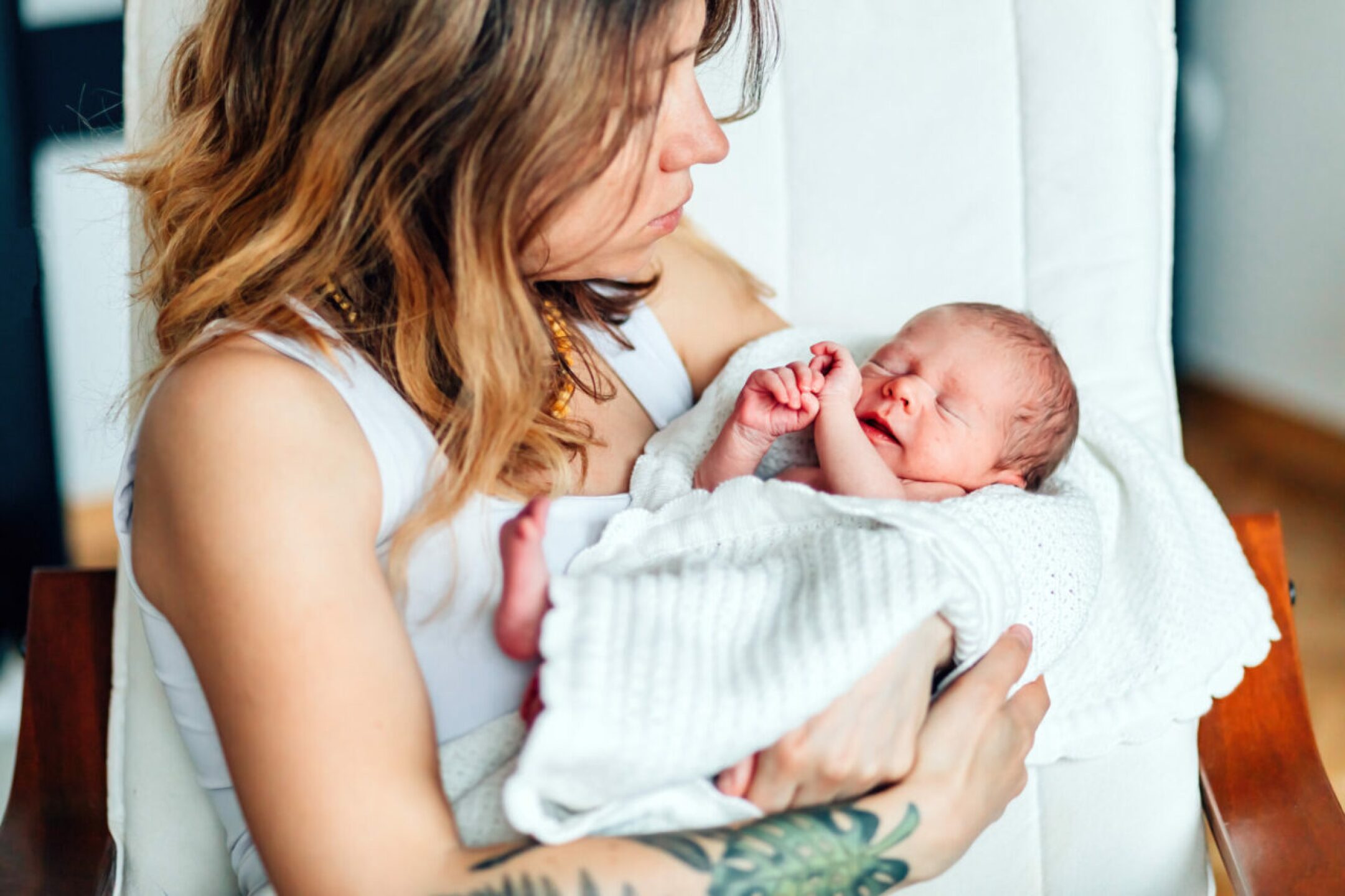 tired-mother-admiring-newborn-baby-in-her-arms-2022-03-01-20-19-46-utc-1280x853