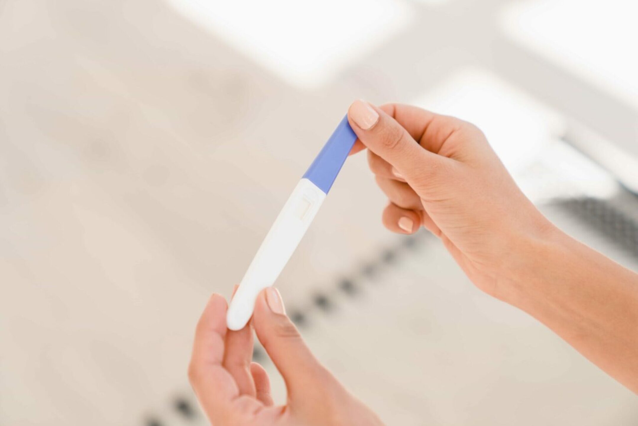 pregnancy-test-woman-female-teenager-holding-preg-2021-12-09-20-04-36-utc-1-1280x854