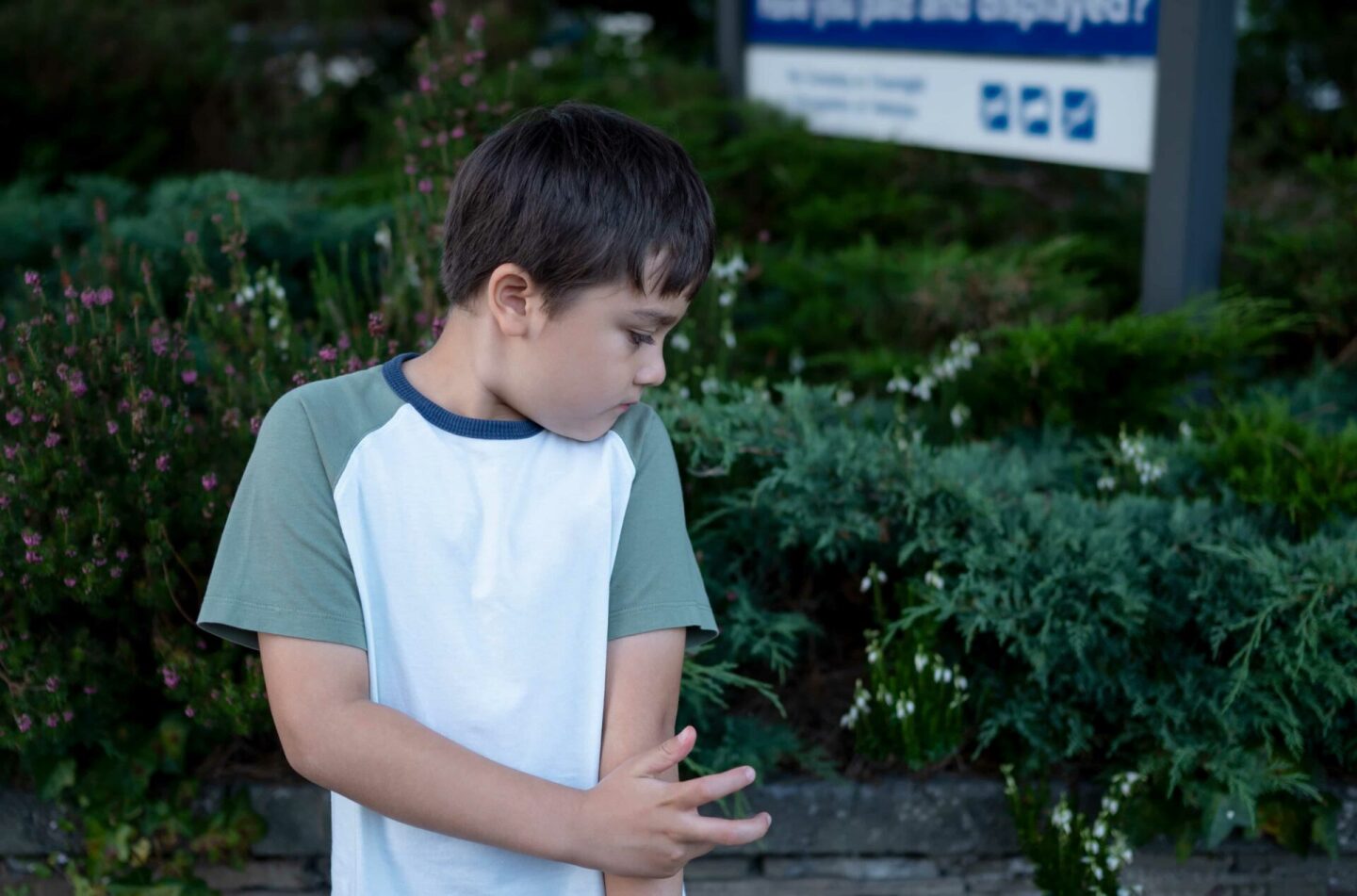 boy-standing-in-the-park-scratching-his-arm-child-2022-11-15-14-13-47-utc (1)