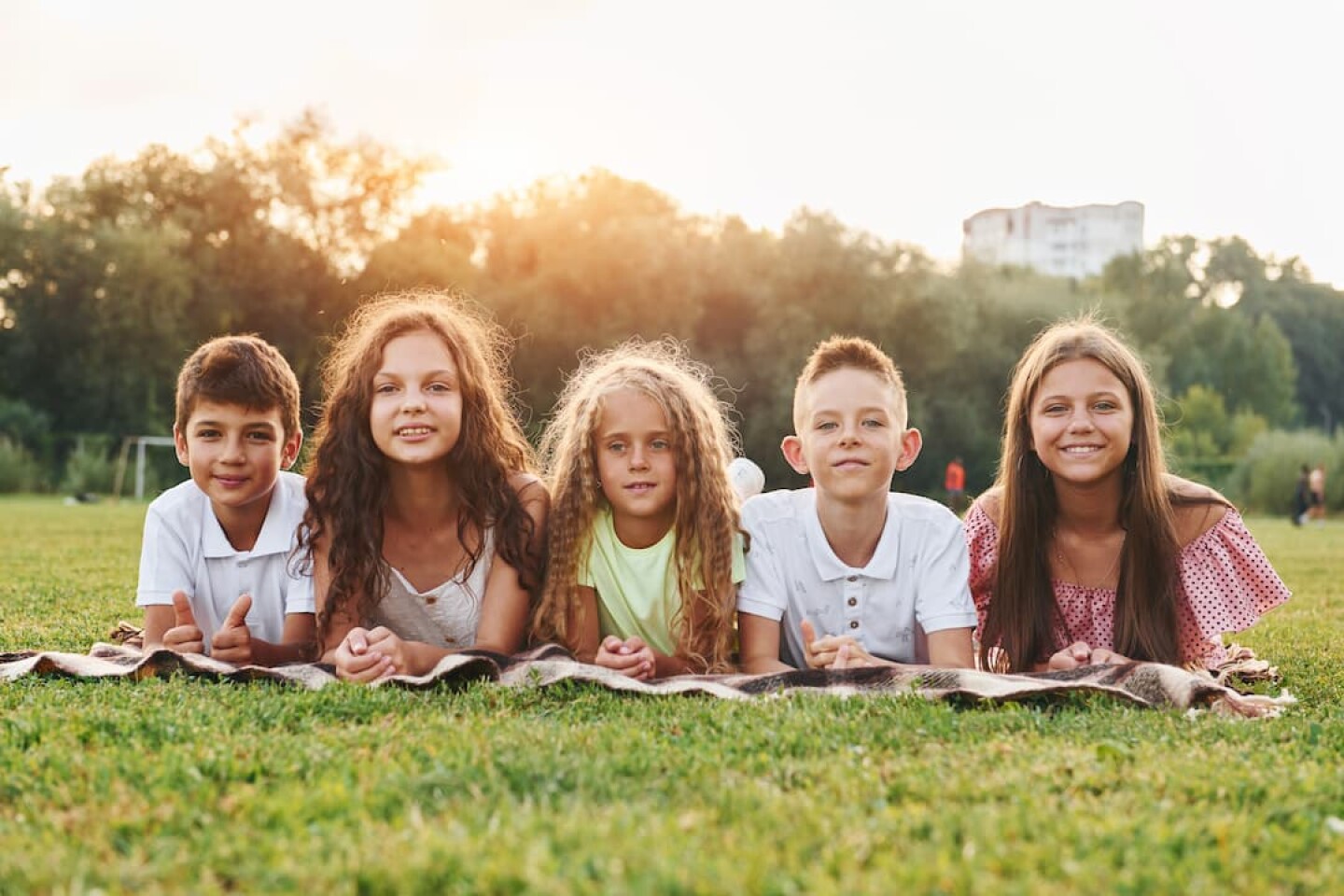 front-view-group-of-happy-kids-is-outdoors-on-the-2023-11-27-05-31-57-utc (1)