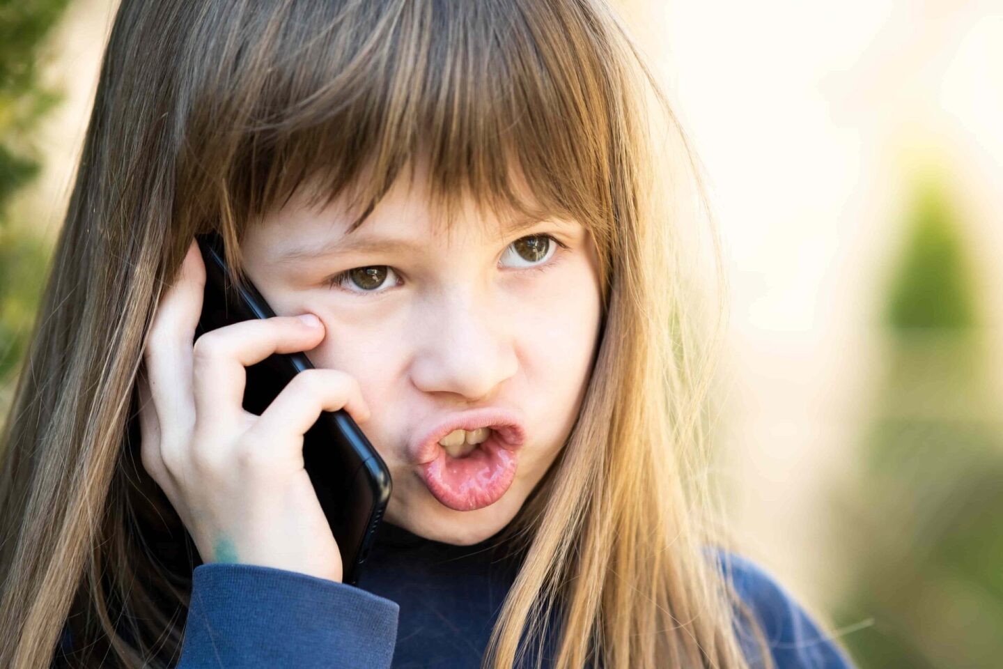 portrait-of-angry-child-girl-with-long-hair-talkin-2022-05-30-22-34-32-utc (1)
