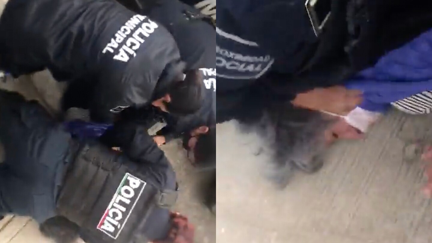 mujer golpeada por policías