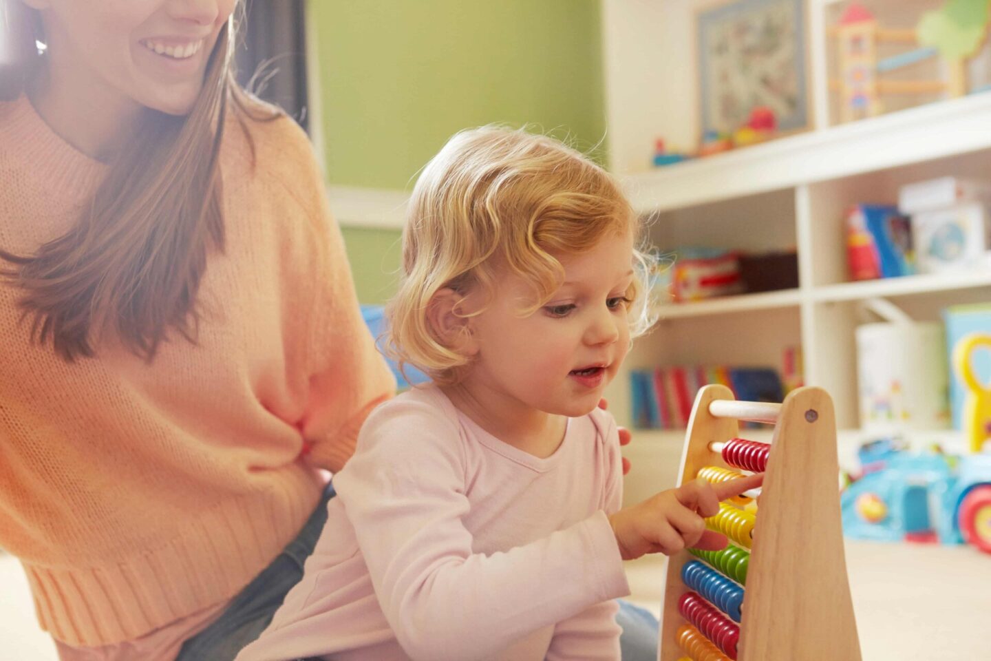 mid-adult-woman-and-toddler-daughter-counting-on-a-2022-03-04-01-52-35-utc (1)