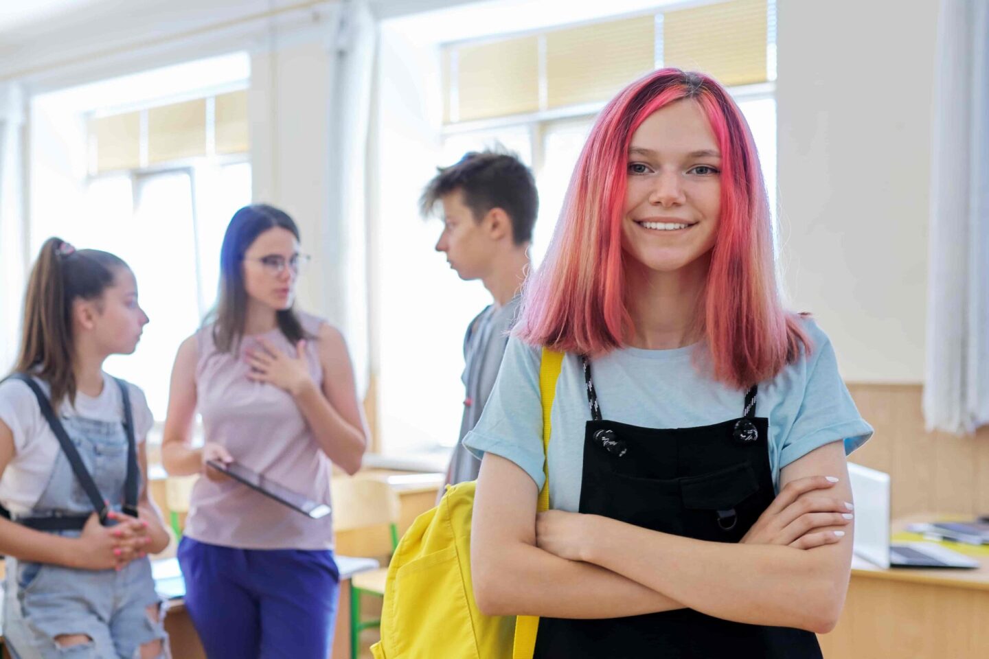 portrait-of-smiling-teenage-girl-in-class-on-break-2023-11-27-05-32-20-utc (1)