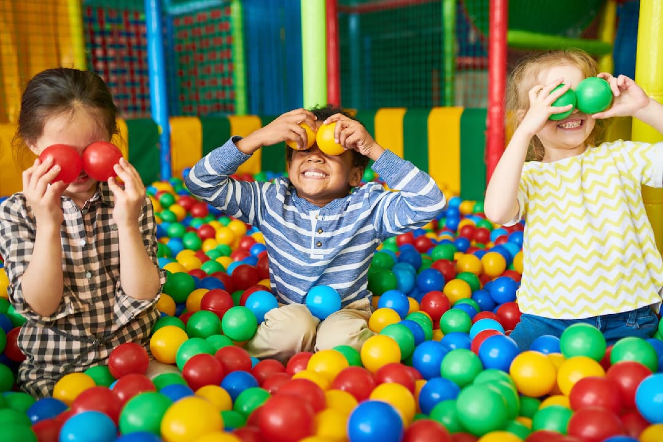 happy-kids-playing-in-ball-pit-2023-11-27-05-26-25-utc-1-1