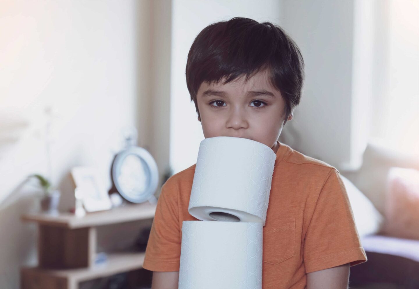 child-carrying-a-stack-of-toilet-paper-kid-holdin-2022-11-15-14-05-53-utc (1)