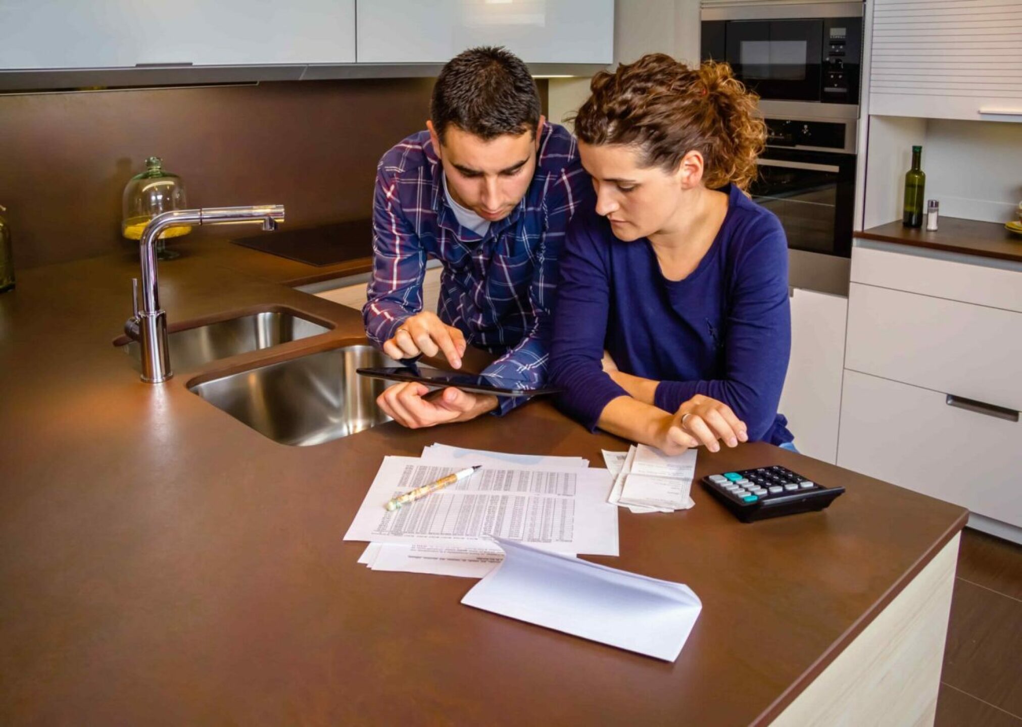 couple-reviewing-their-accounts-with-a-digital-tab-2021-09-02-19-14-36-utc-1280x911