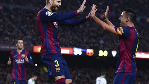 Xavi Hernández y Gerard Piqué
