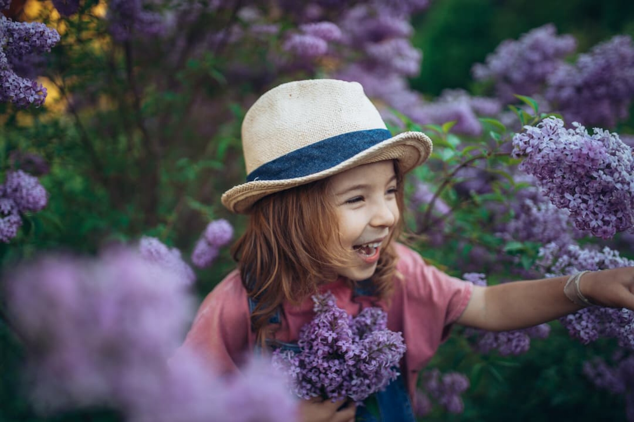 portrait-of-little-girl-with-lilac-spring-mood-2023-11-27-05-35-04-utc