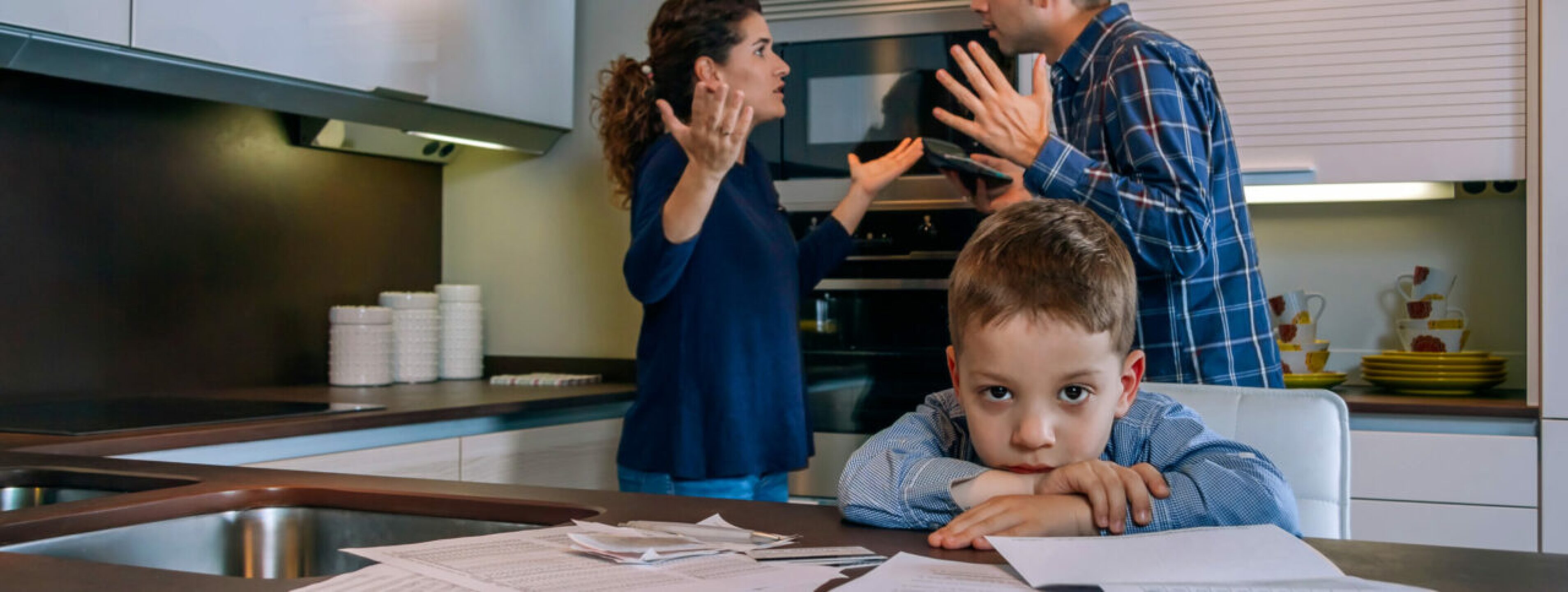 sad-boy-looking-camera-while-his-parents-argue-2021-09-03-03-42-20-utc-1280x483