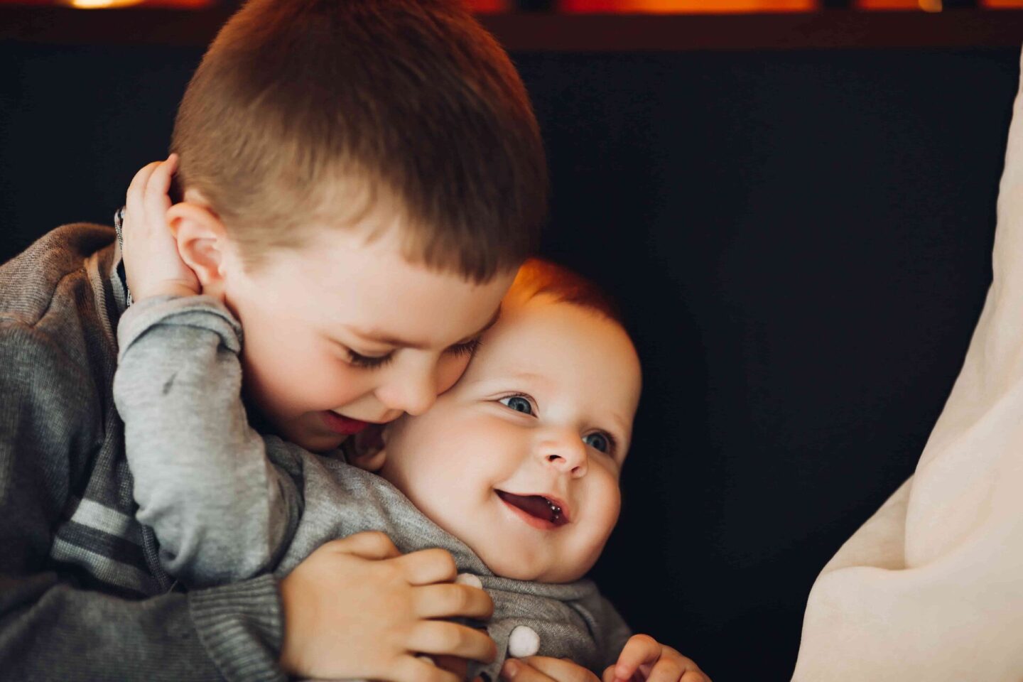 happy-boy-embracing-his-little-little-brother-2021-09-03-06-34-44-utc (1)