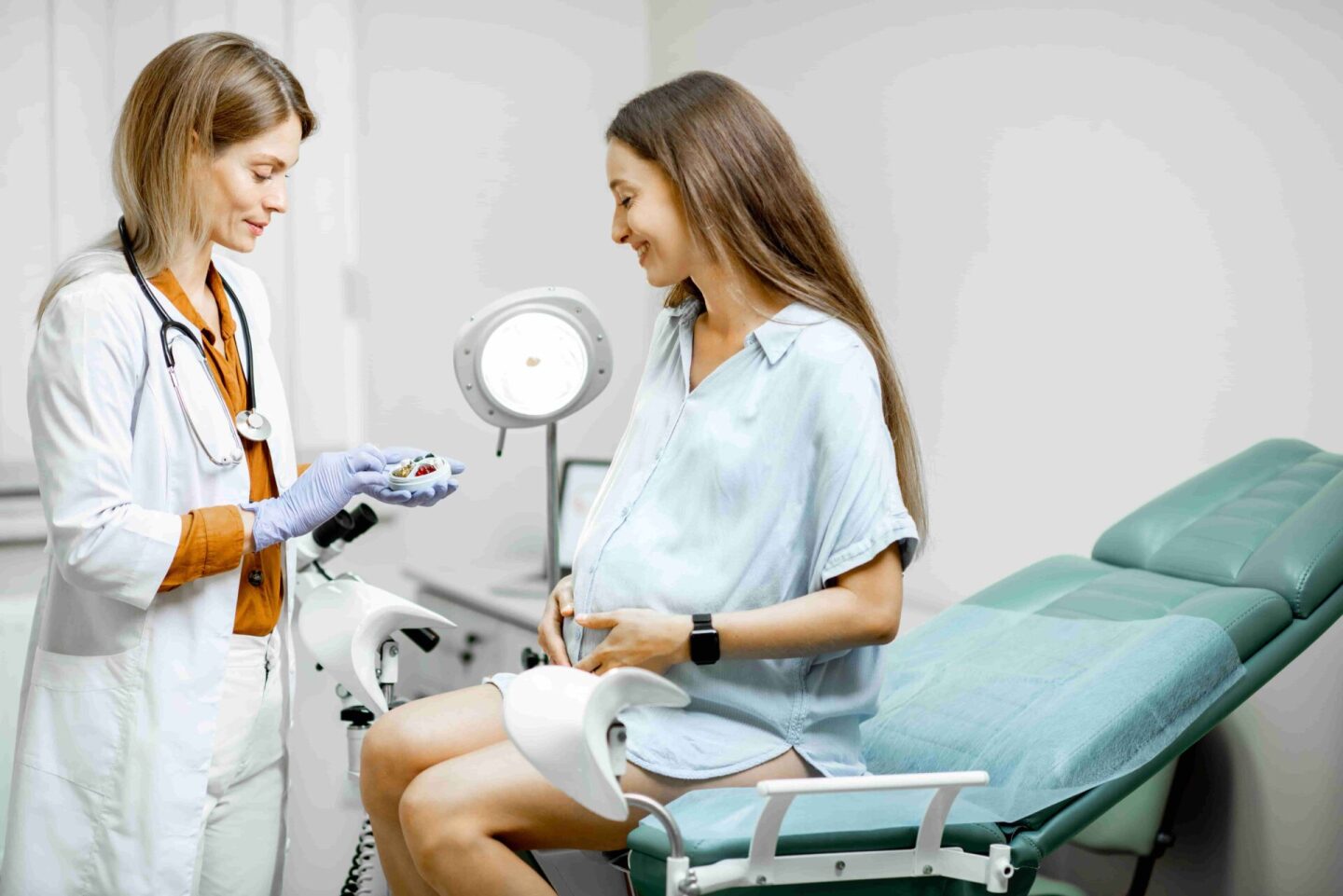 gynecologist-giving-some-medicine-for-a-young-preg-2022-01-18-23-45-19-utc (1)