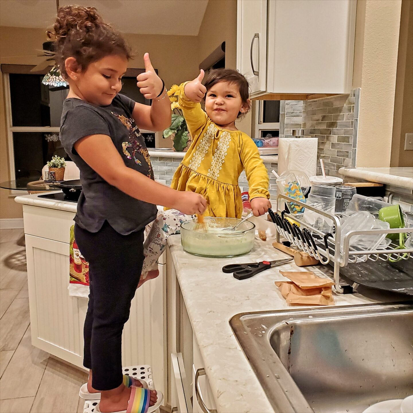 young-sisters-cooking-together-2021-10-23-10-55-03-utc