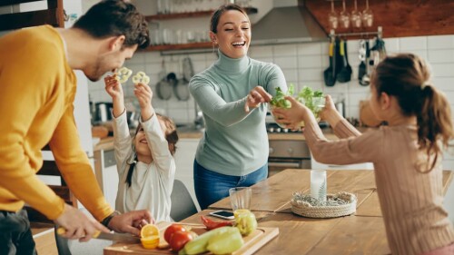 happy-family-having-fun-while-preparing-healthy-fo-2023-11-27-04-55-47-utc (1)