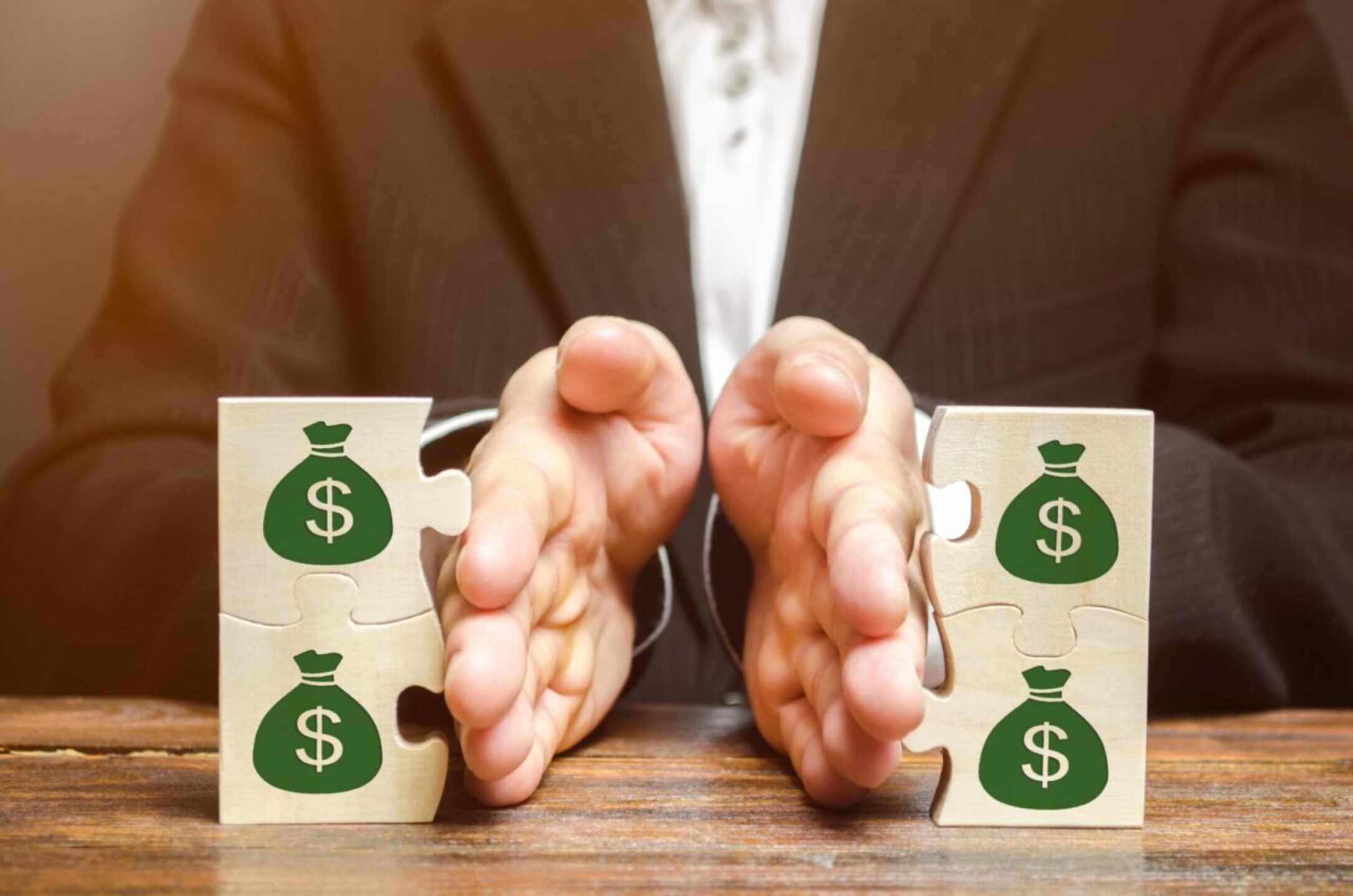 businessman-separates-the-wooden-puzzle-with-a-pic-2022-11-09-06-32-06-utc-1-1280x848