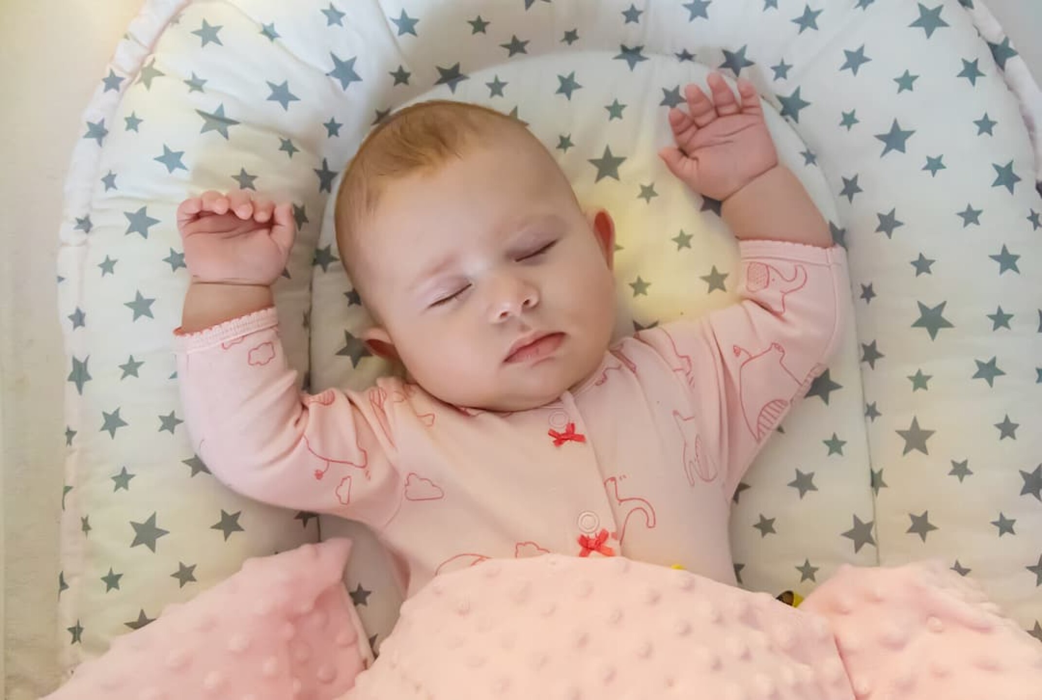 baby-sleeps-on-a-pink-bed-selective-focus-2023-11-27-05-30-30-utc-1