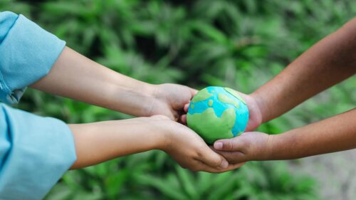 two-people-holding-environmental-protection-concep-2023-03-22-04-51-27-utc (1)