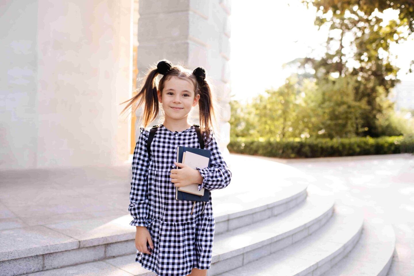 smiling-little-kid-girl-hold-books-for-study-retur-2022-11-17-15-44-36-utc (1)