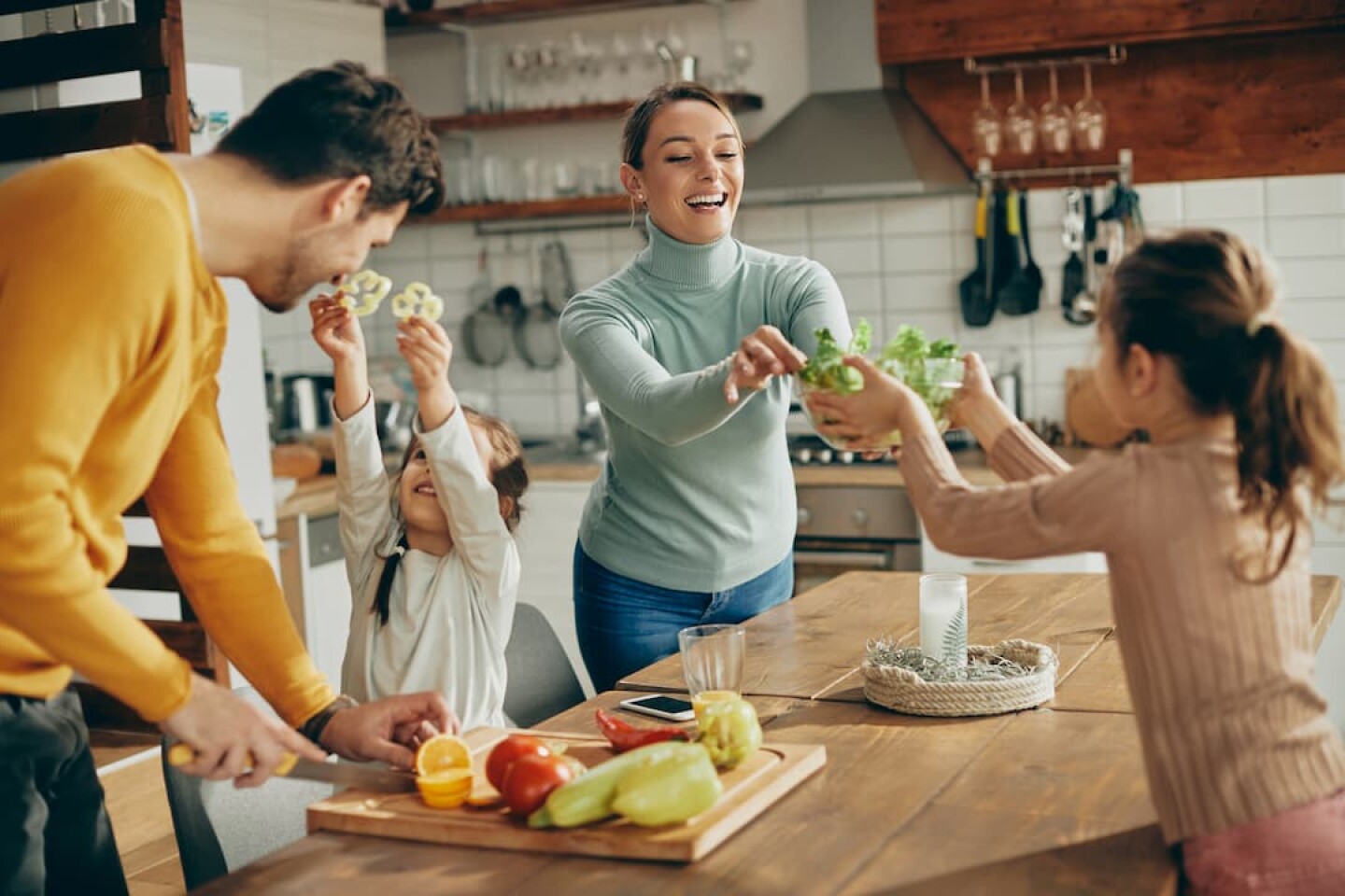 happy-family-having-fun-while-preparing-healthy-fo-2023-11-27-04-55-47-utc (1)