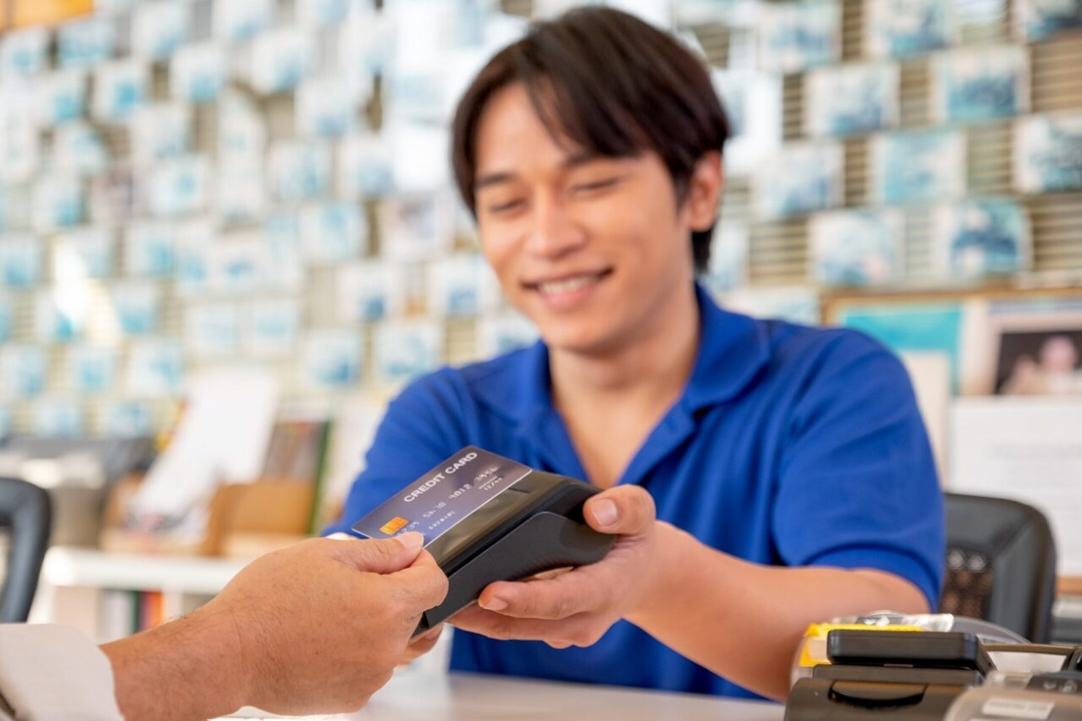 main-focus-on-credit-card-of-asian-worker-or-staff-2022-01-19-00-11-53-utc-1280x853