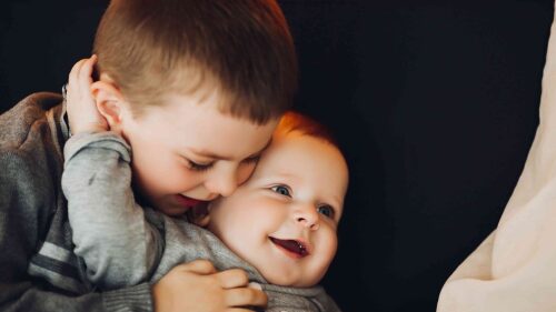 happy-boy-embracing-his-little-little-brother-2021-09-03-06-34-44-utc (1)