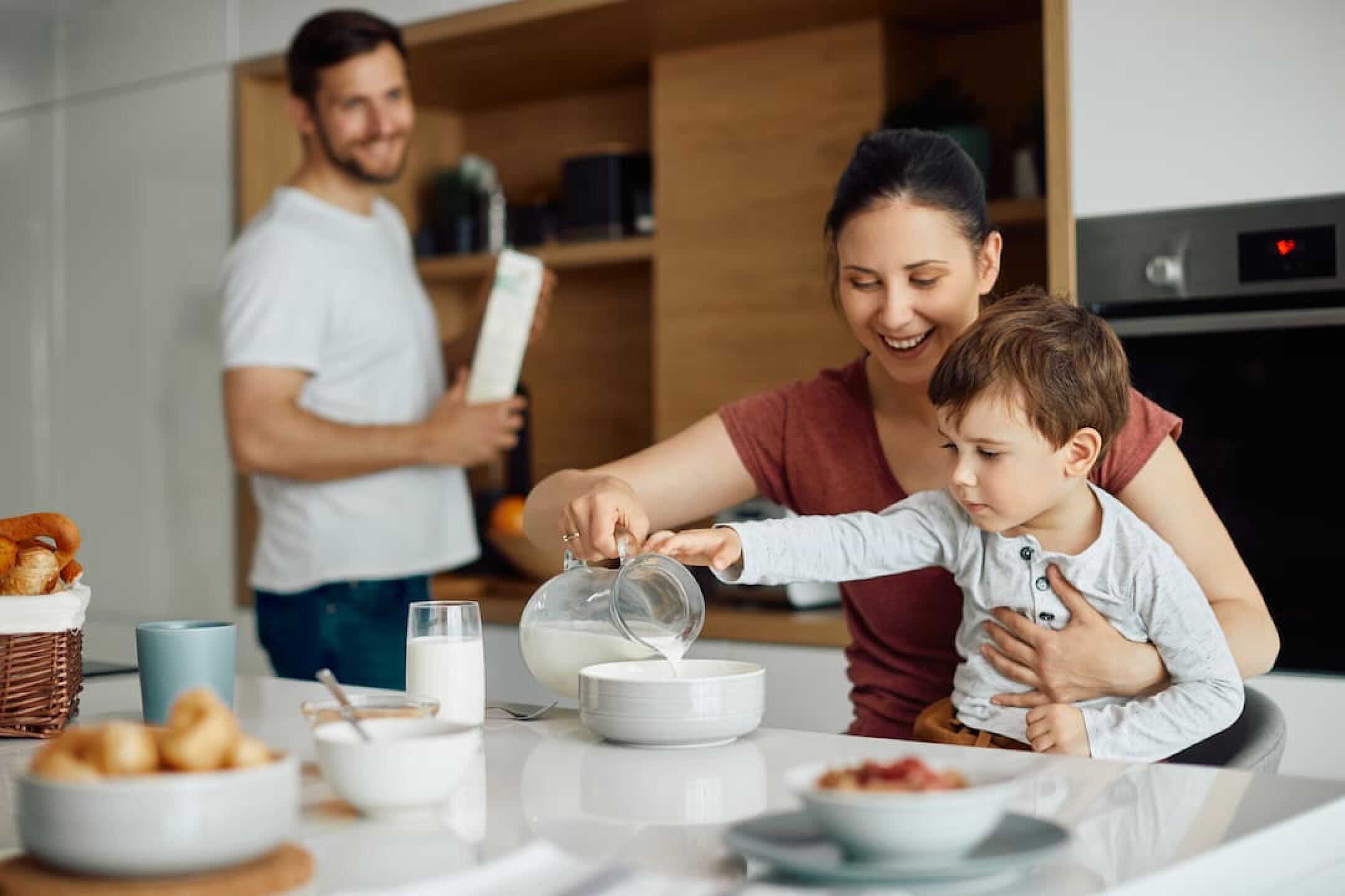 happy-mother-and-son-enjoying-in-breakfast-at-home-2023-11-27-04-59-42-utc-1
