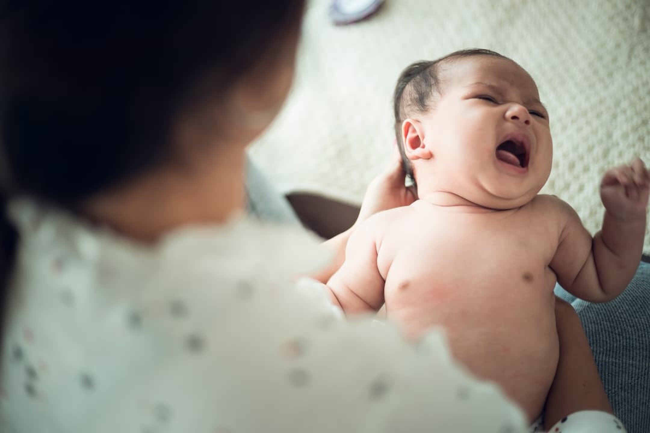 a-newborn-baby-in-the-hand-of-his-mother-2023-11-27-04-52-39-utc-1