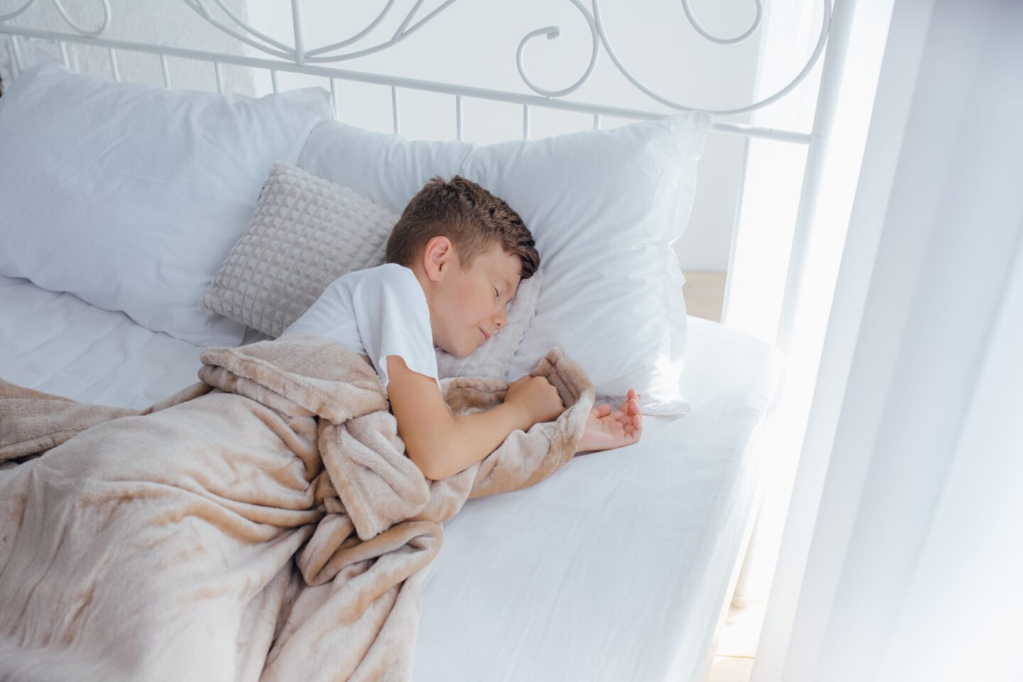 Cute little kid sleeping. Little boy sleeping in bed