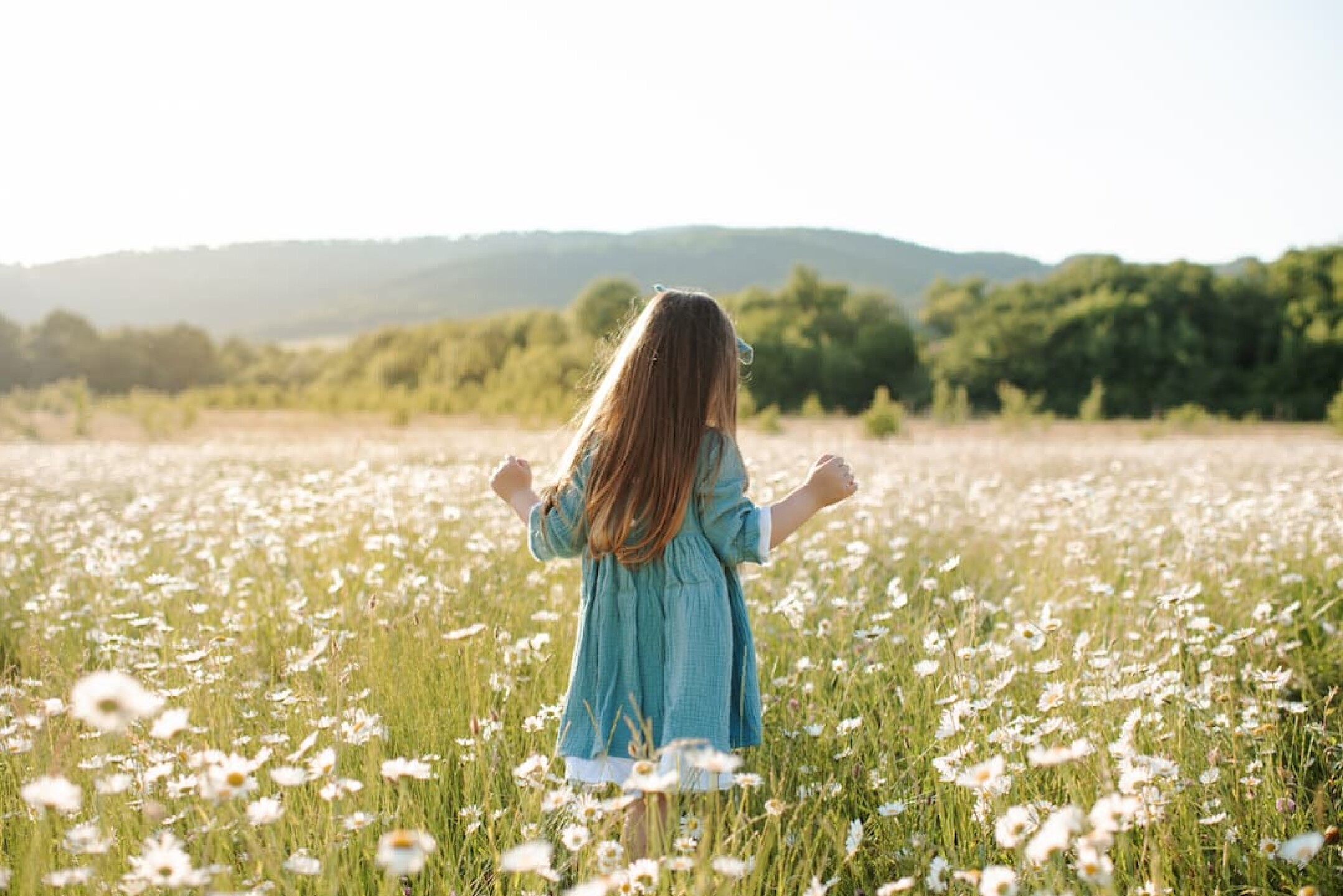 stylish-kid-girl-in-floral-field-outdoor-2023-11-27-05-19-27-utc-1