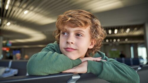 Adorable kid waiting for flight