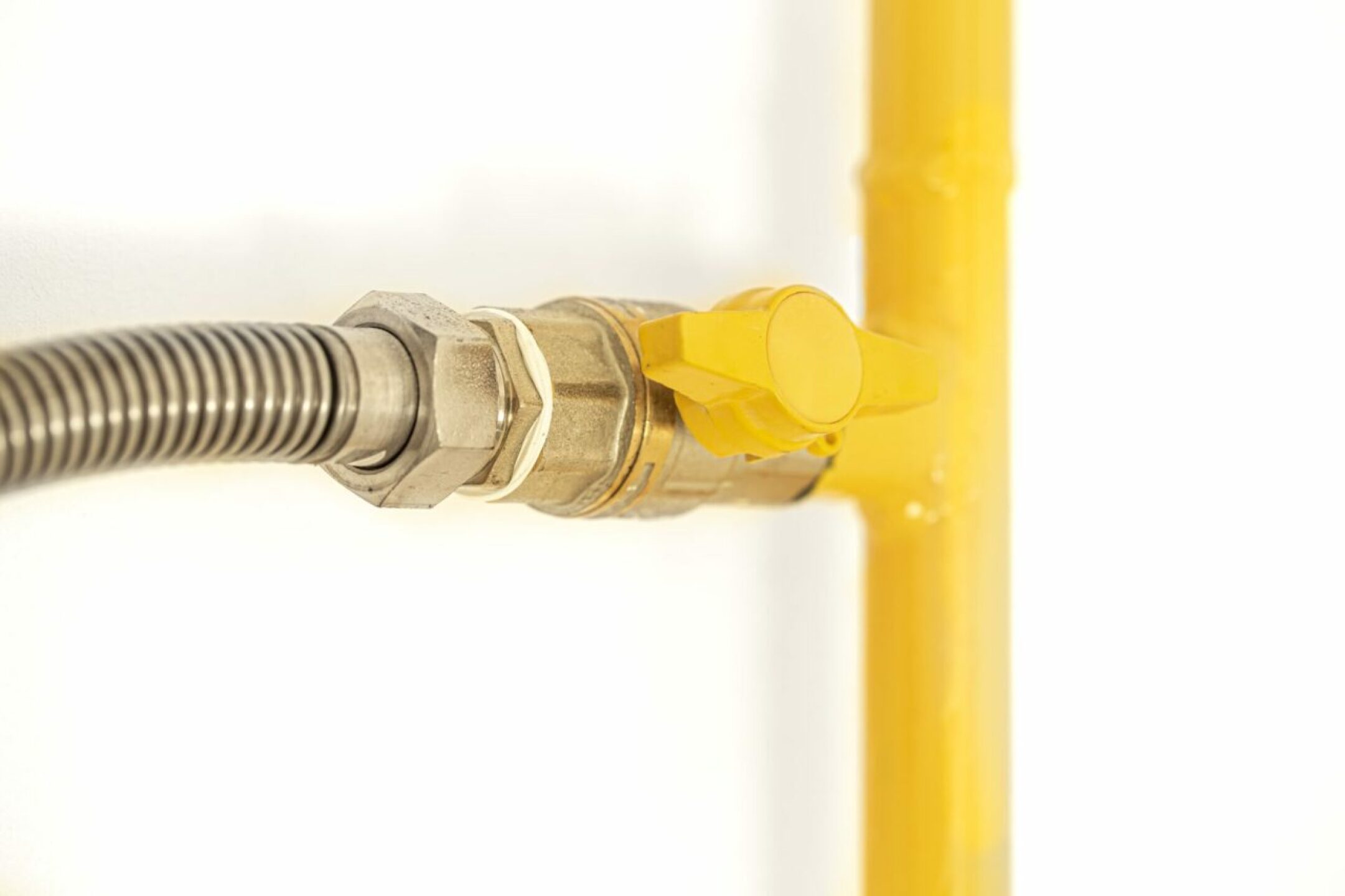 yellow-gas-pipe-with-a-valve-white-background-2021-08-31-22-50-23-utc-1280x853